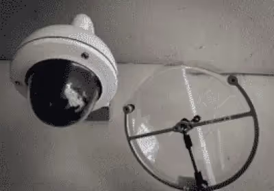 a security camera next to a KLOVER MiK 09