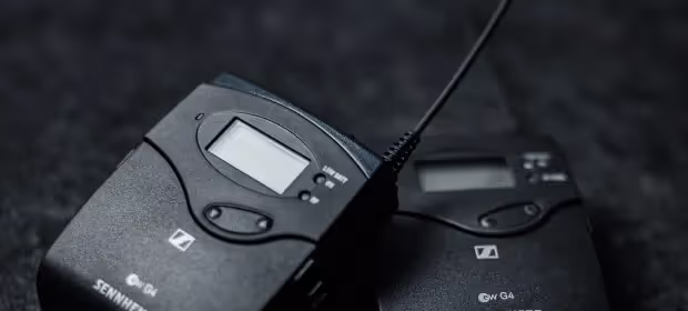 A wireless microphone transmitter and receiver